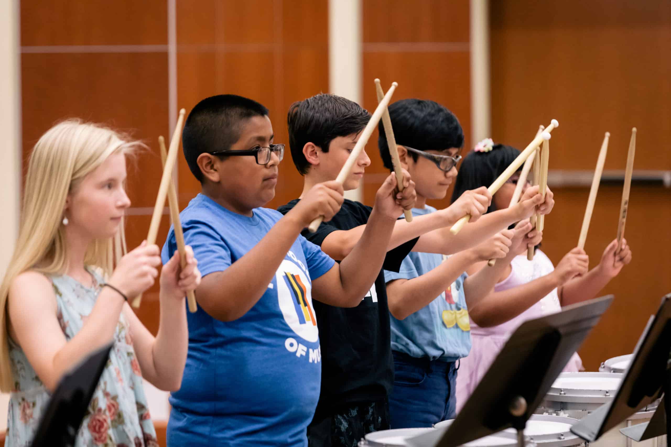 Students learning the snare drum at Merit summer camp