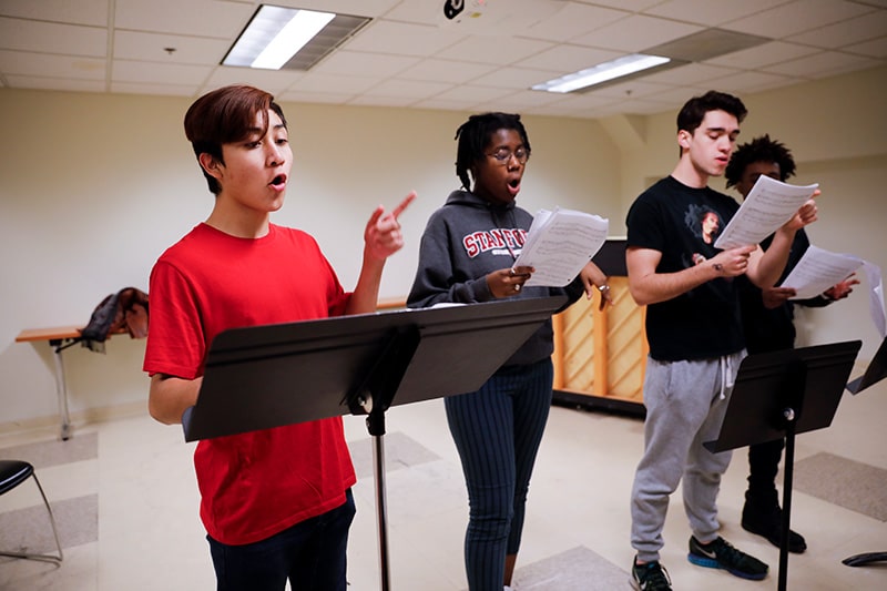 choir students in an ensemble class learning their music