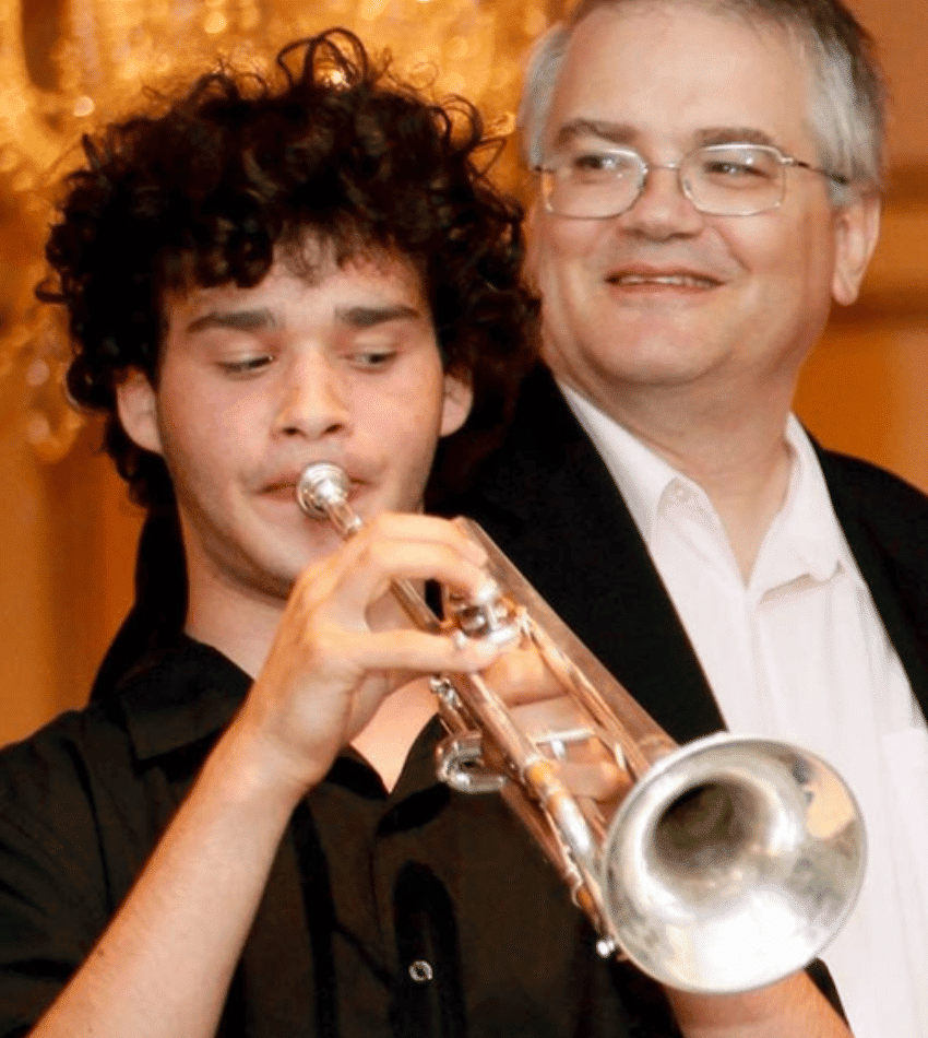 A young Nico Segal plays trumpet, standing next to Michael McLaughlin.